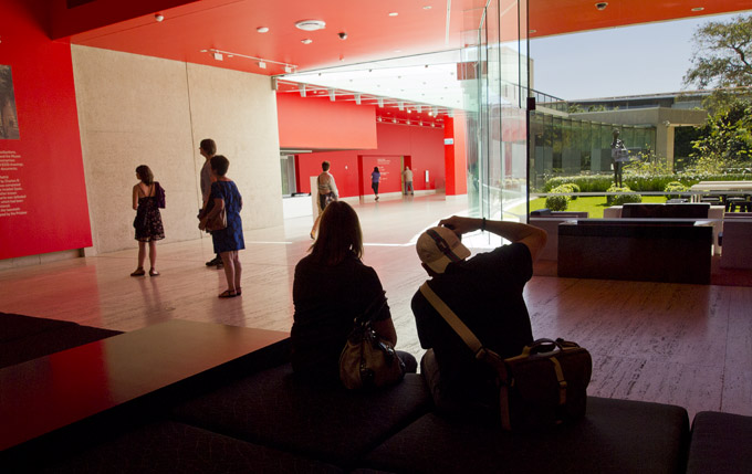 A gallery visitor photographing ......Portrait of Spain: Masterpieces from the Prado