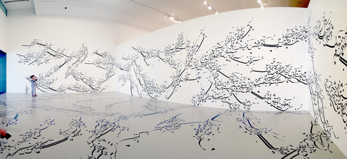 A visitor photographs Parastou Forouhar's Written room 1999–ongoing