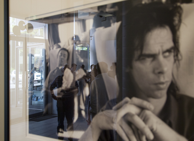 Peter Milne's portrait of Nick Cave reflects visitors to the Treasures show