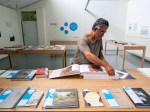 Photobook Melbourne: Peter Lyssiotis looking at an Aperture&nbsp;Books
