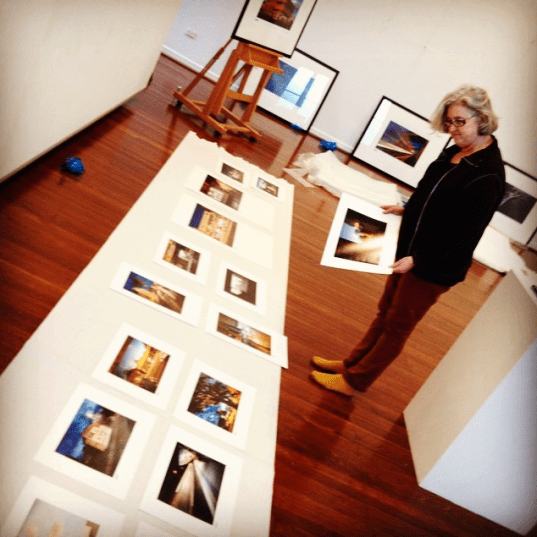 Vicky arranging the hang copy