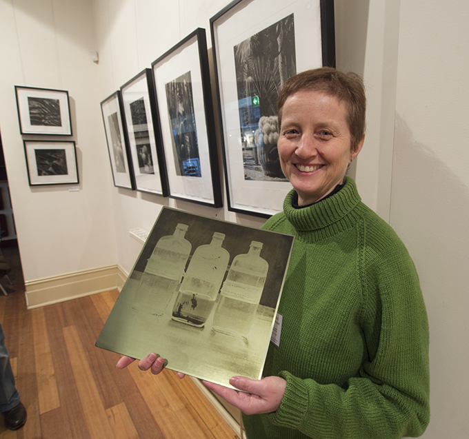 Silvi Glattauer holding a gravure plate of an image from ‘Organic Balance’ 