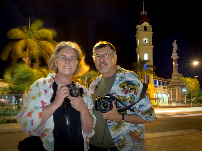 The artists in tropical garb with palm trees...