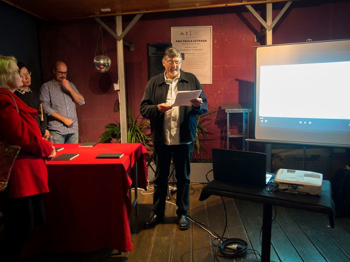 Doug Spowart reading his essay from the book