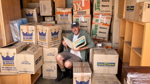 In the storage shed opening boxes looking for books