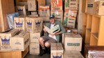 Doug sorting through book&nbsp;boxes