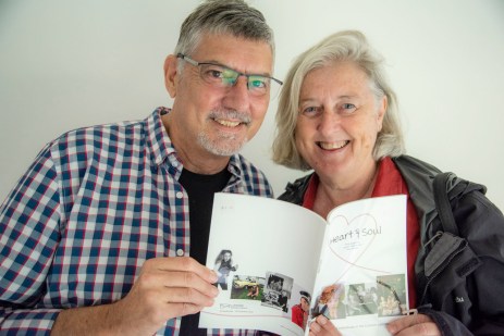 Vicky + Doug with the catalogue for the Heart&amp;Soul exhibition by Jacklyn and Peter PHOTO: Peter Derret