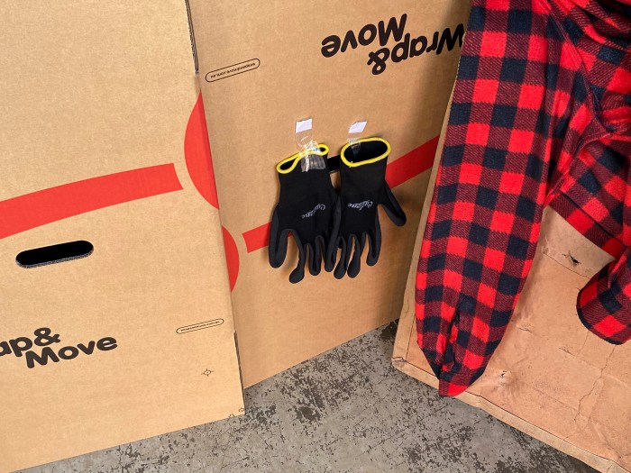 Two gloves either side of the hand-hold opening to reduce the aperture size