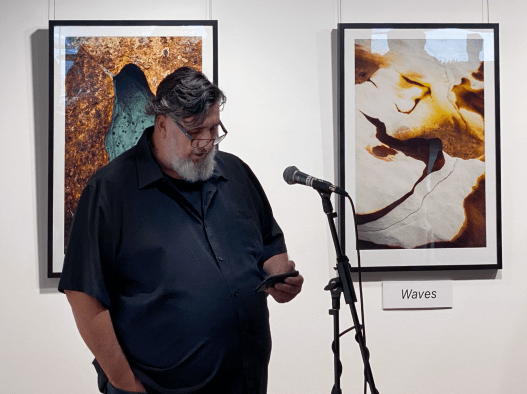 Robert Lewis, Larrakia Warrior', speaks at Ncholas Walton-Healey's exhibition SALT FRAMES at the Library at the Docks in Melbourne/Naarm on 15 March 2023