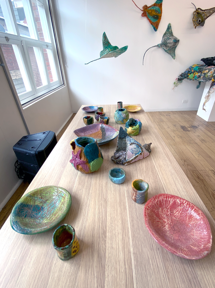 Georgia Szmerling ceramics (front) &amp; Erub ArtsTorres Strait and Ghost Net Collective (back wall)